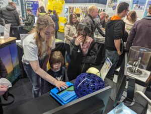 Children having a go at the brain scanner simulator